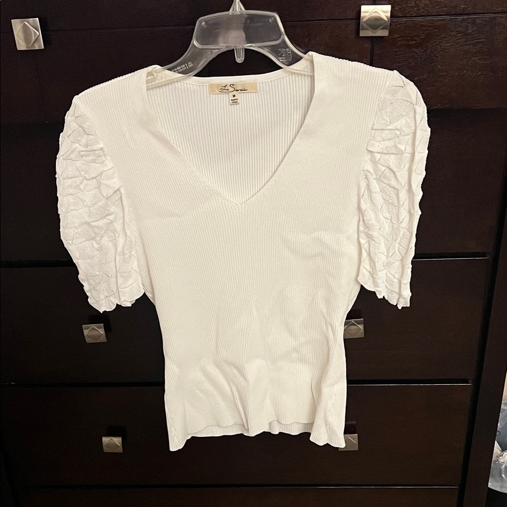 Elegant White V-Neck Blouse with Textured Sleeves